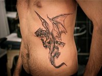 Тату дракон на боку