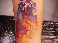 Тату цветной лев в очках