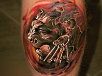 тату лев с ключами