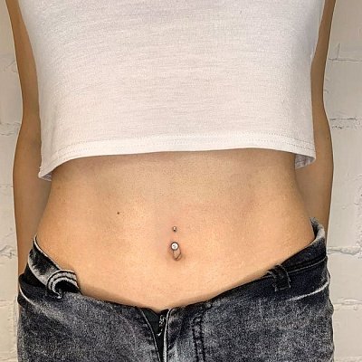 Пирсинг пупка для женщин