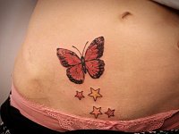 Тату на животе звезды и бабочка