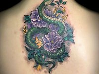 Тату змея с пионами