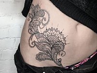 Тату узор на животе