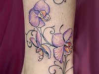 Тату орхидея на щиколотке