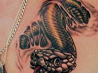 Мужская тату змея