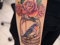 Тату птица в клетке