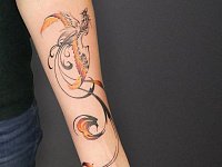 Тату феникс на предплечье