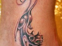 Женская татуировка кошка