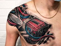 Татуировка биомеханика на груди