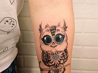 Татуировка совы на предплечье