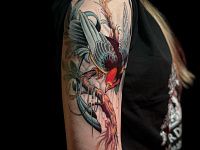 Татуировка птица на ветке