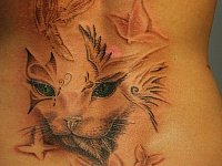 тату в виде кошки на спине