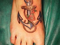 Женская тату якорь