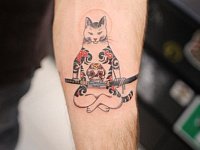 Небольшая татуировка кот