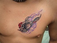 Тату на груди биомеханика