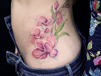 Тату орхидея на боку