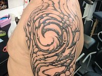 тату трайбл мужская