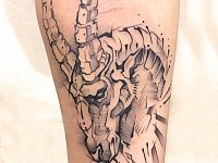 Тату козерог на предплечье