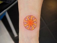 тату знак солнцеворот