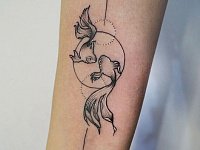 Тату рыбки на руке