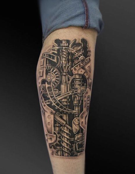 Татуировка биомеханика на ноге