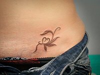 Тату на интимном месте веточка