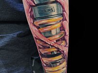 Тату в стиле биомеханика на руке