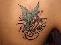 Женская тату эльф на лопатке