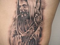 Тату Иисус на ребрах