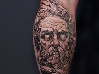 Тату посейдон на икре