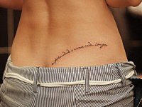 Тату надпись на пояснице