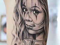 тату девушка арлекин